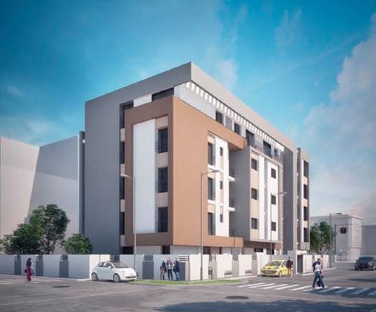 Immeuble d'habitation de cinq niveaux à façade grise et cuivrée